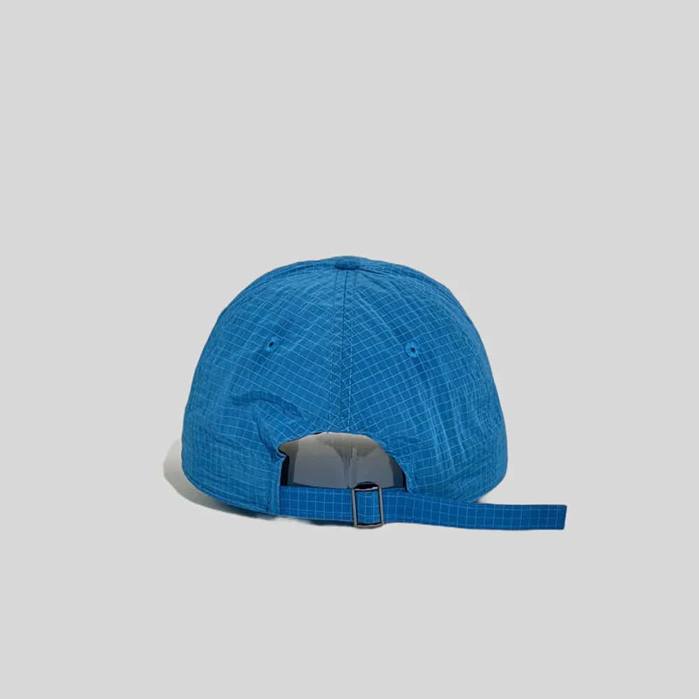 Adjustable baseball cap in blue and pale yellow, rear view showing the open back and metal slider strap