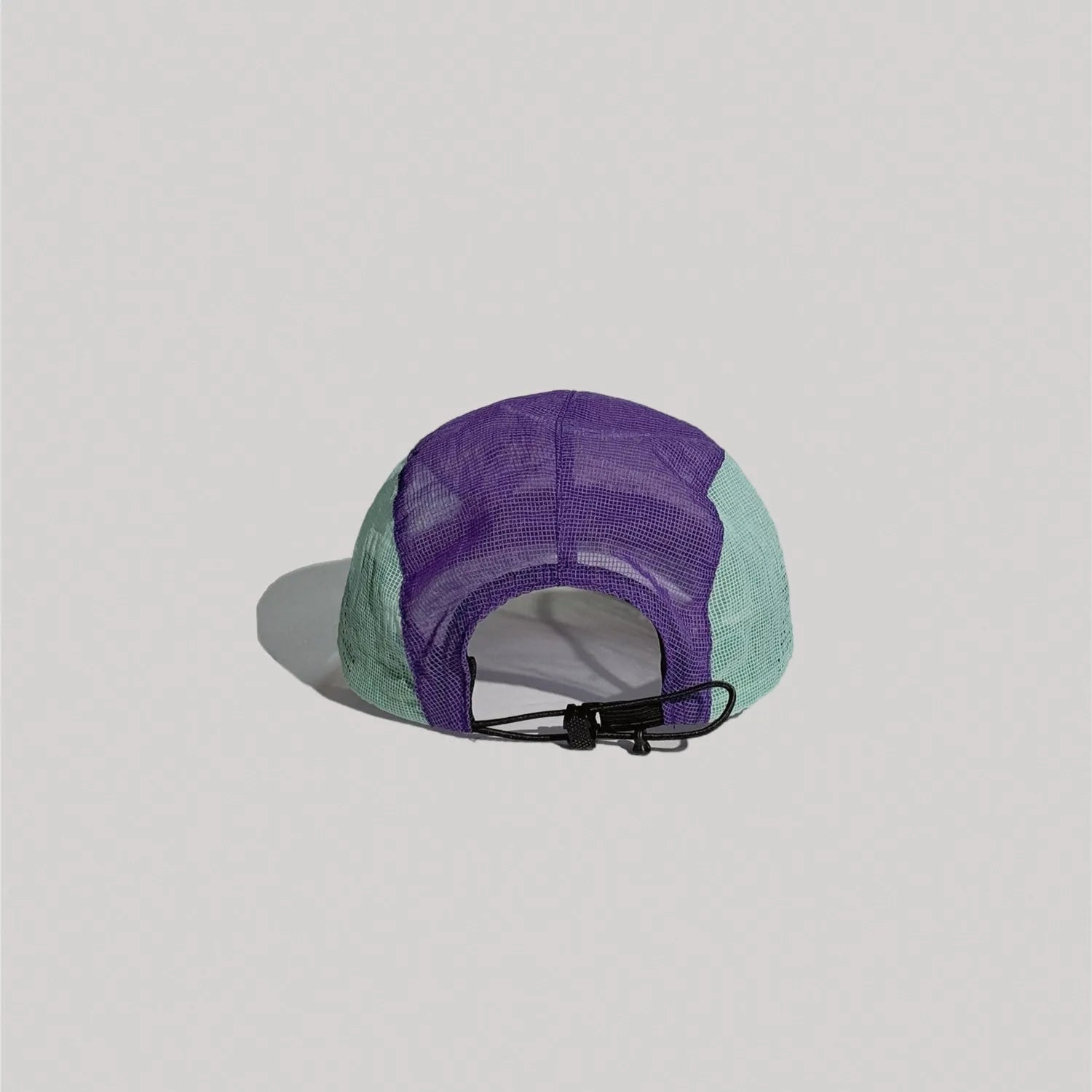 Back view of nylon mesh cap with adjustable strap closure and breathable panel design