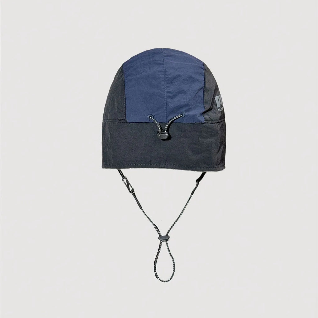 Adjustable nylon winter cap showing rear fastening system and stitched panel details