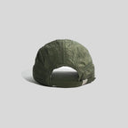 Adjustable sports cap in olive green, rear view showing the open back, fabric strap and silver-tone buckle