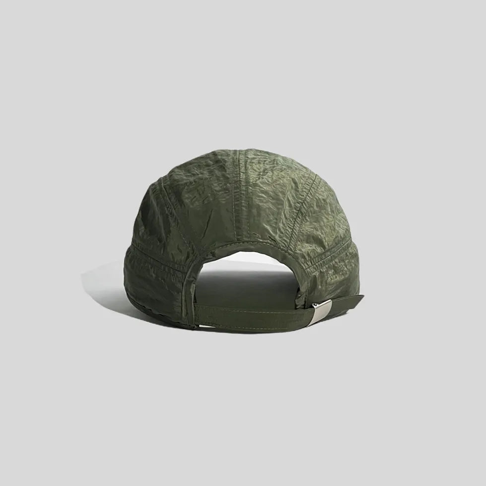Adjustable sports cap in olive green, rear view showing the open back, fabric strap and silver-tone buckle