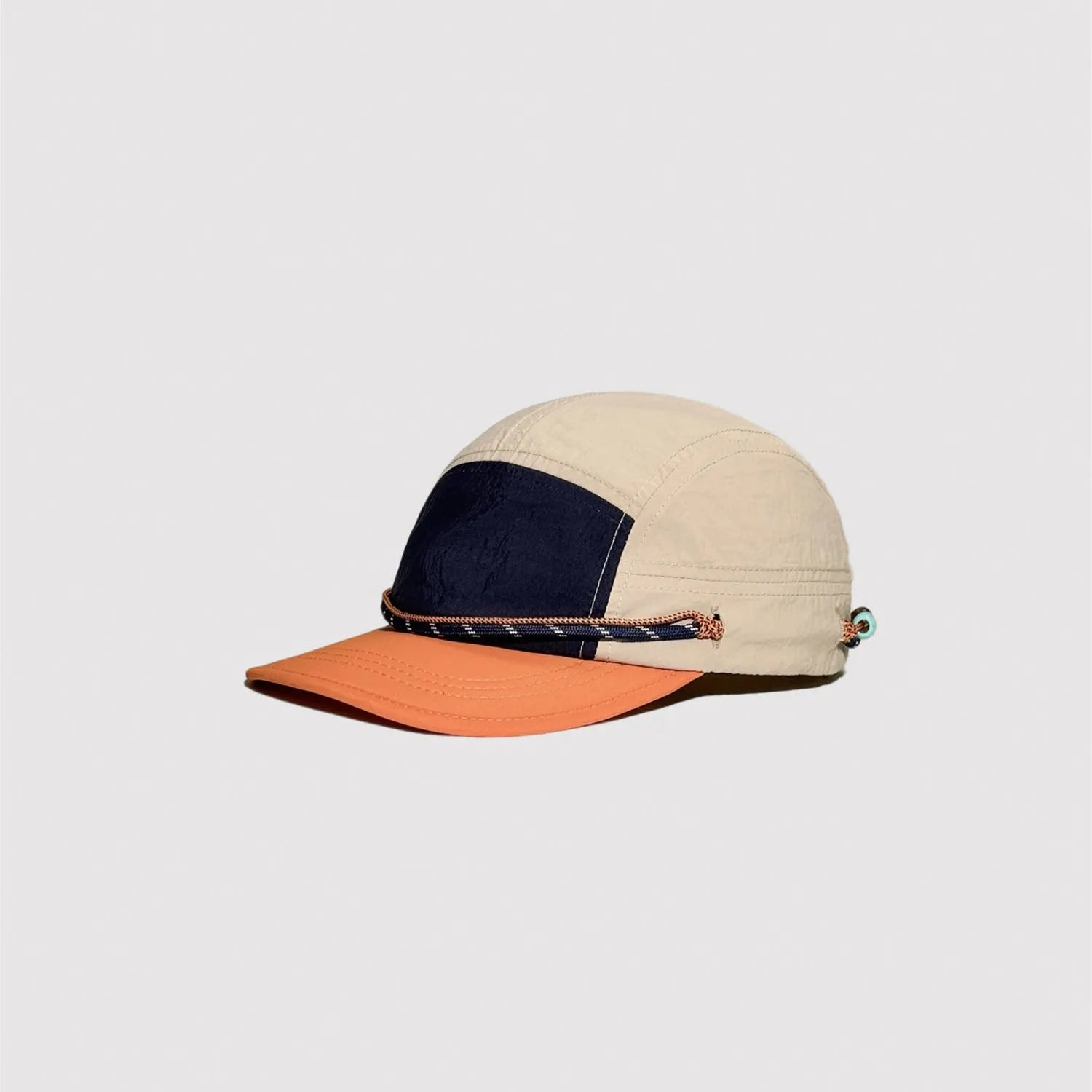 Beige and orange nylon camp cap with colour block 5 panel design