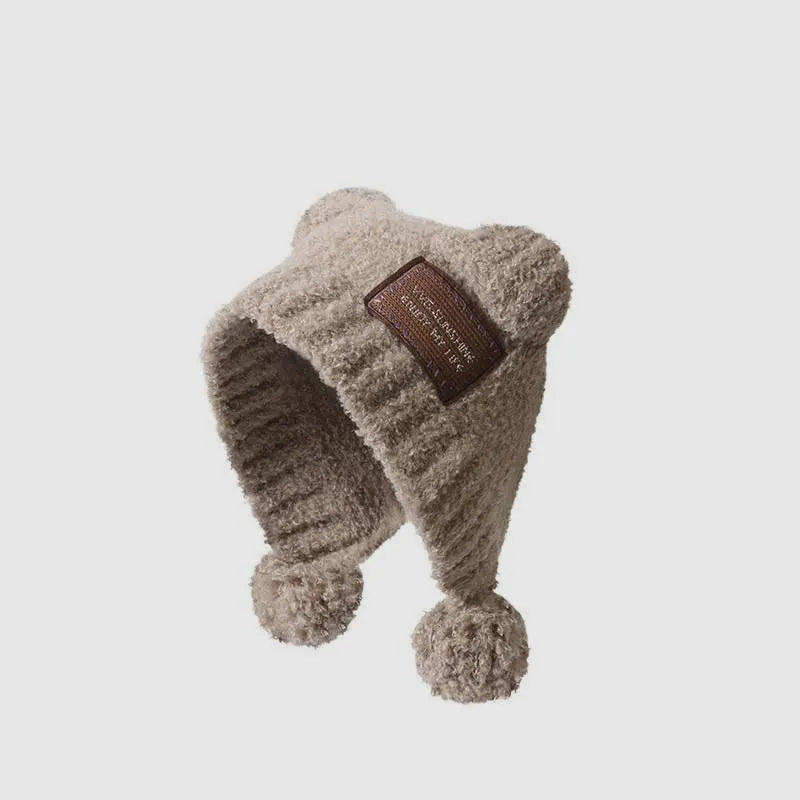 Beige teddy fleece winter hat with bear ear detail and soft plush ear flaps