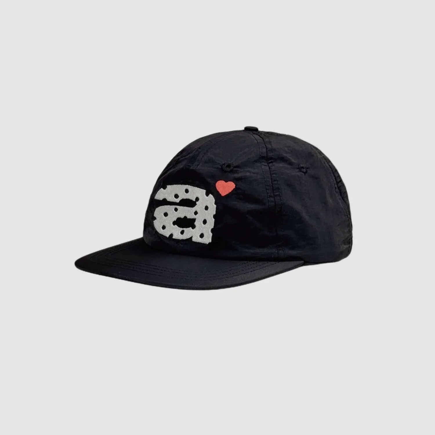 Black lightweight nylon cap with flat brim and casual outdoor style