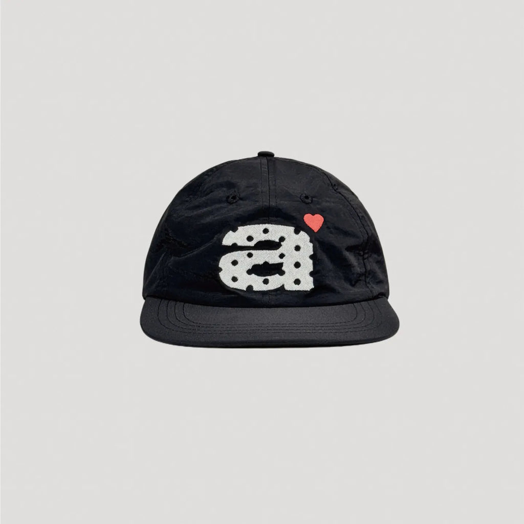 Black nylon 5 panel cap with contrast embroidered graphic and flat brim design