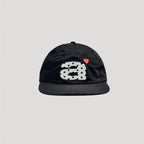 Black nylon 5 panel cap with contrast embroidered graphic and flat brim design
