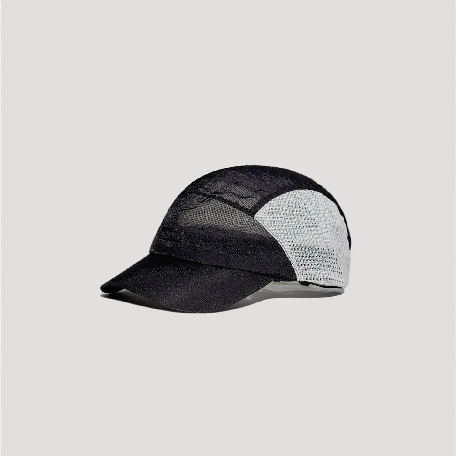 Black and white five panel mesh cap with technical outdoor inspired styling