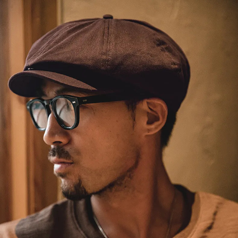 British style cabbie cap worn with casual smart outfit for timeless look