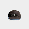 Front view of a brown five-panel cap with raised white EEE embroidery, light blue brim trim and a black side bow detail.