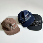 Brown, navy and black embroidered baseball caps with colourful graphic designs and curved brims for casual everyday wear.