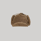 Brown sherpa cap top view showing plush fleece texture and structured crown