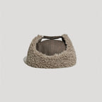 Brown winter trapper hat back view showing sherpa lining and extended ear coverage