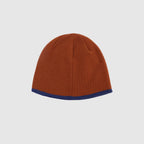 Brown acrylic knit winter beanie with contrast blue trim and classic fitted shape