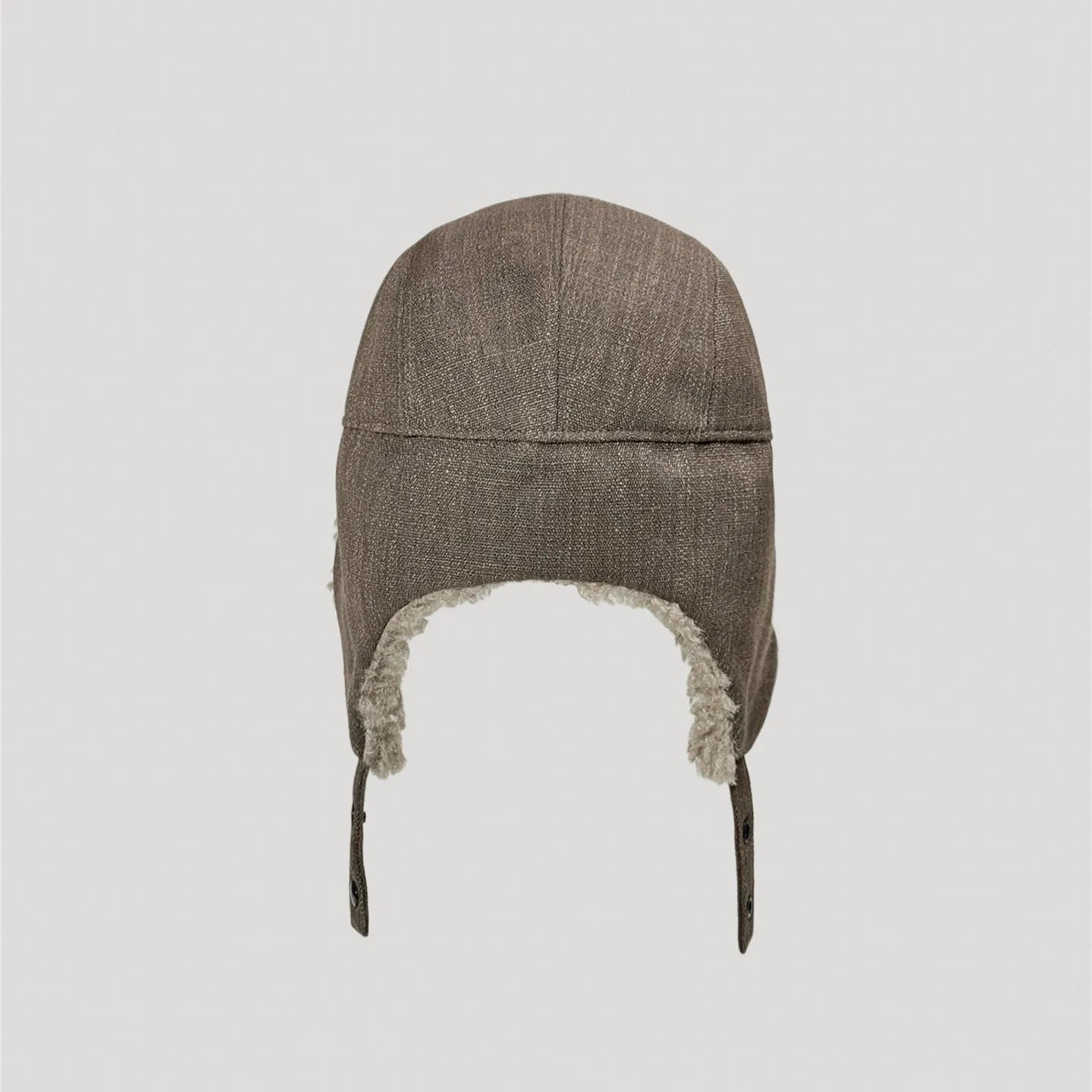 Brown winter hat back view showing extended ear flap coverage