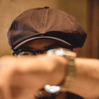 Classic baker boy cap with rounded crown and short curved brim for vintage fashion