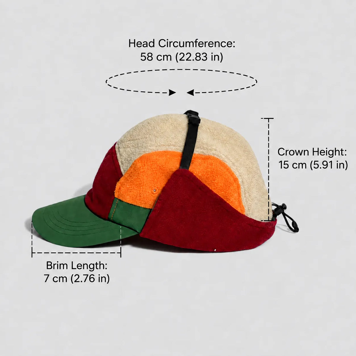 Colour-block ear flap cap size guide with a 58 cm circumference, 15 cm crown and 7 cm peak