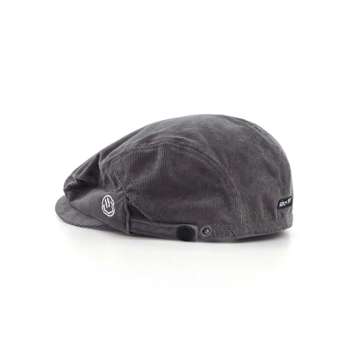 Cotton corduroy flat cap in charcoal grey, side view with a short peak, smile embroidery and side snap adjuster

