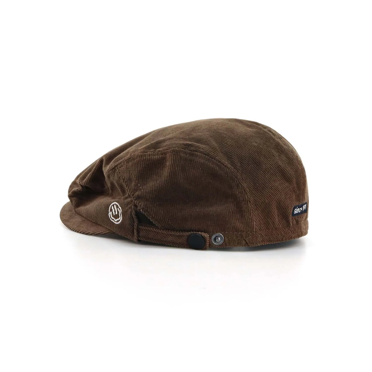 Cotton corduroy flat cap in medium brown, side view with a short peak, smile embroidery and side snap adjuster
