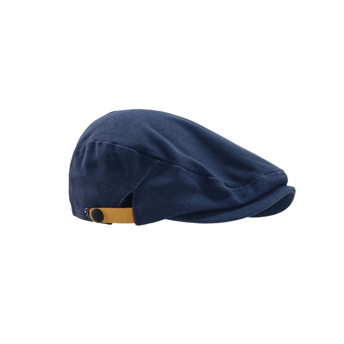 Navy cotton flat cap in a clean side profile, showing its short peak, sculpted seams and contrasting tan adjustment tab