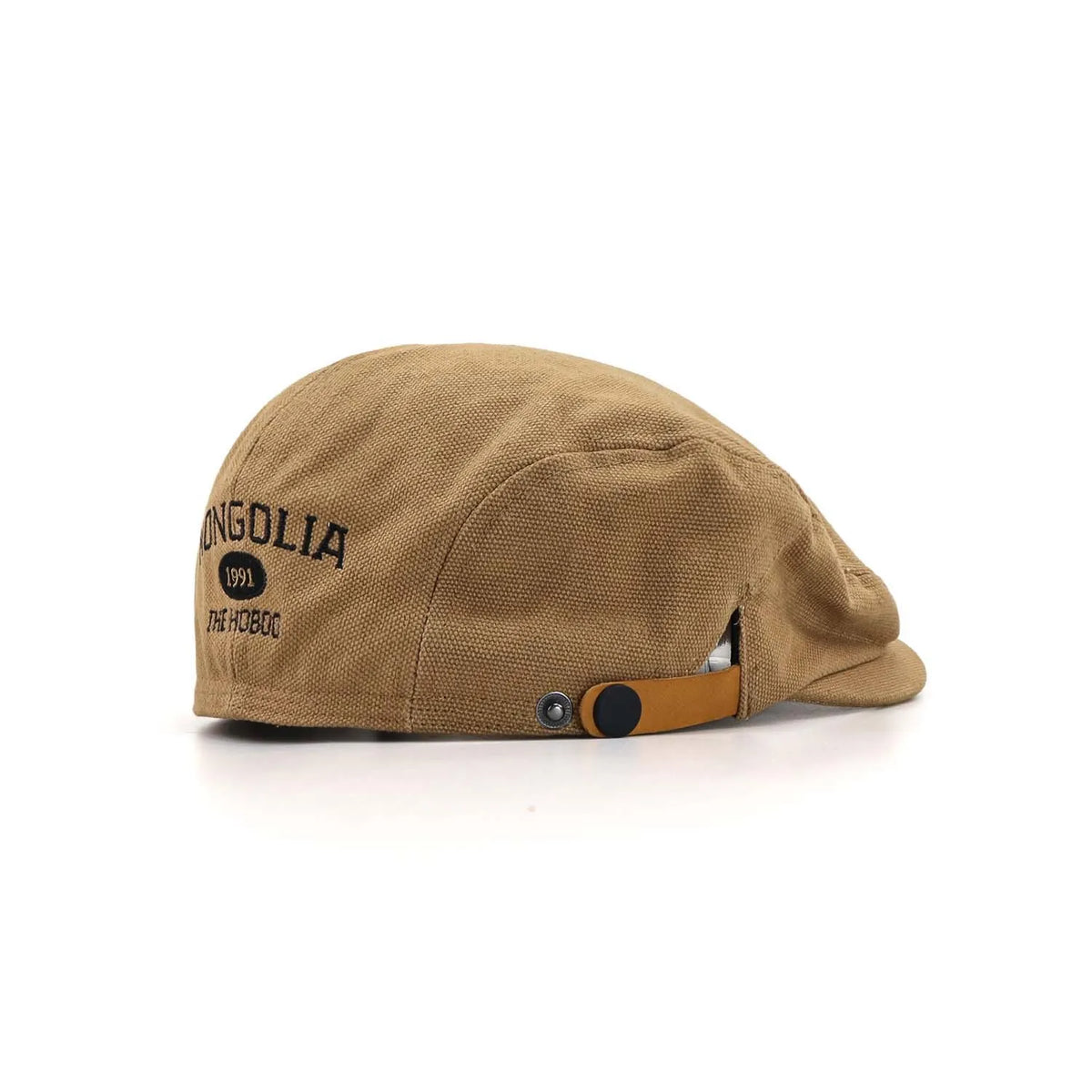 Embroidered cotton ivy cap in camel, angled from the rear with MONGOLIA 1991 lettering and a tan press-stud tab