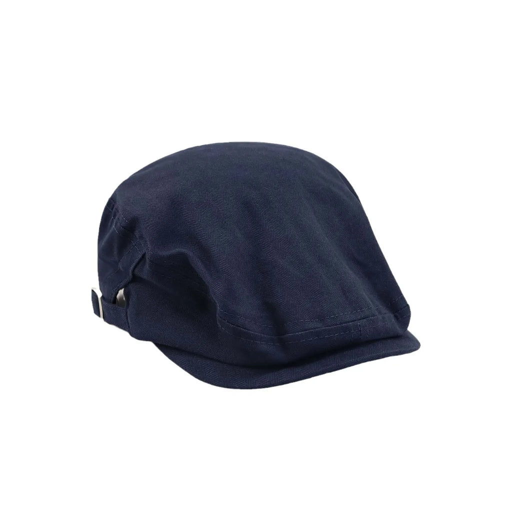 Cotton ivy cap in navy, front angle showing the soft low-profile crown, short peak and tonal herringbone texture