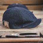 Denim driving cap with curved short brim and refined casual style