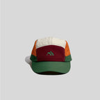 Embroidered five panel cap in cream, burgundy, orange and green, front view with mountain logo and curved brim