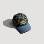 Embroidered plaid outdoor cap featuring retro lettering and detailed fabric pattern