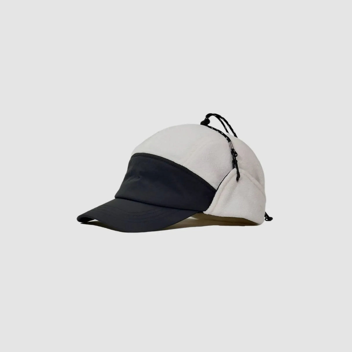 White and black fleece-lined baseball cap side view with contrast crown, curved peak and adjustable cord.