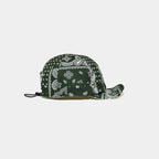 Green cotton cycling cap with an all-over white paisley print, short cream brim and panelled design for cycling and casual outdoor styling.