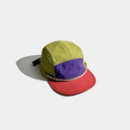 Technical outdoor cap design with contrast panels and lightweight fabric