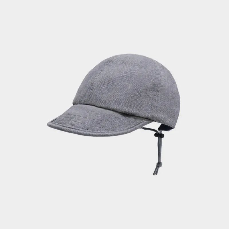 Grey cotton short brim cap with a plain rounded crown and adjustable rear drawcord