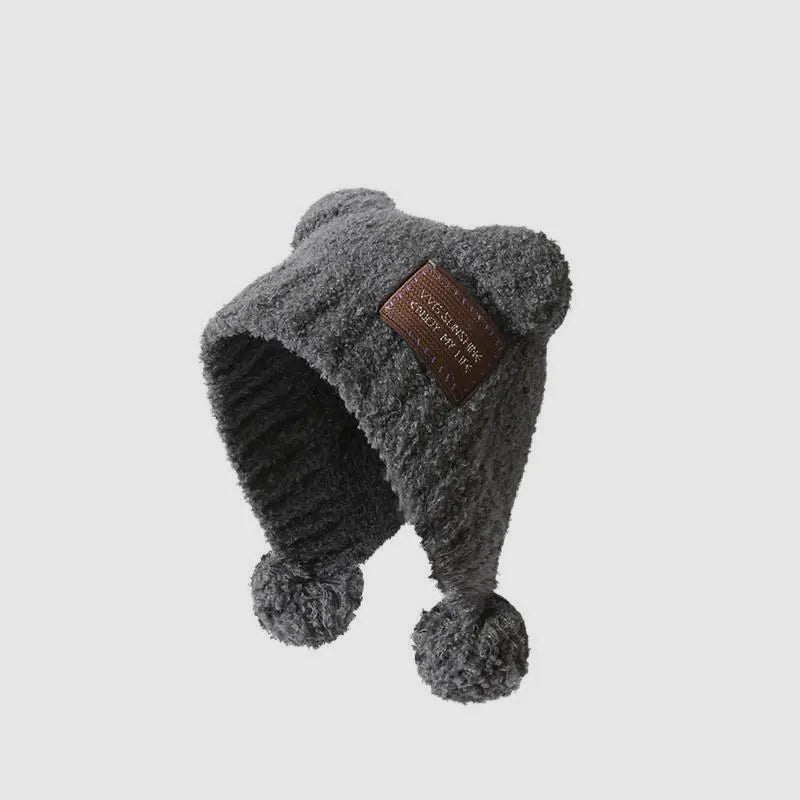 Grey faux fur texture trapper hat with ear covering design for stylish winter looks