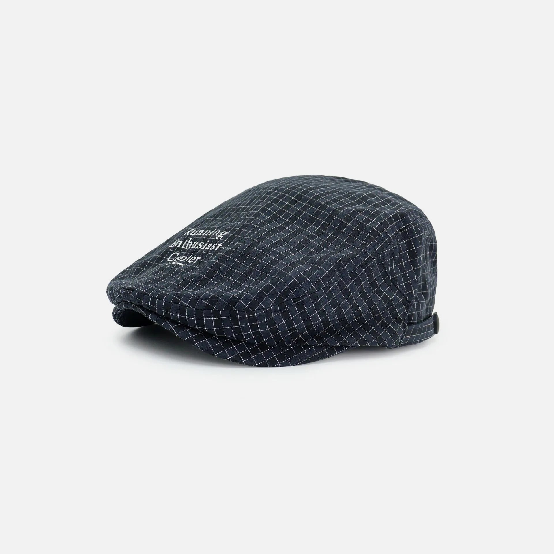 Men's navy plaid flat cap with a curved brim, letter print and adjustable side strap.