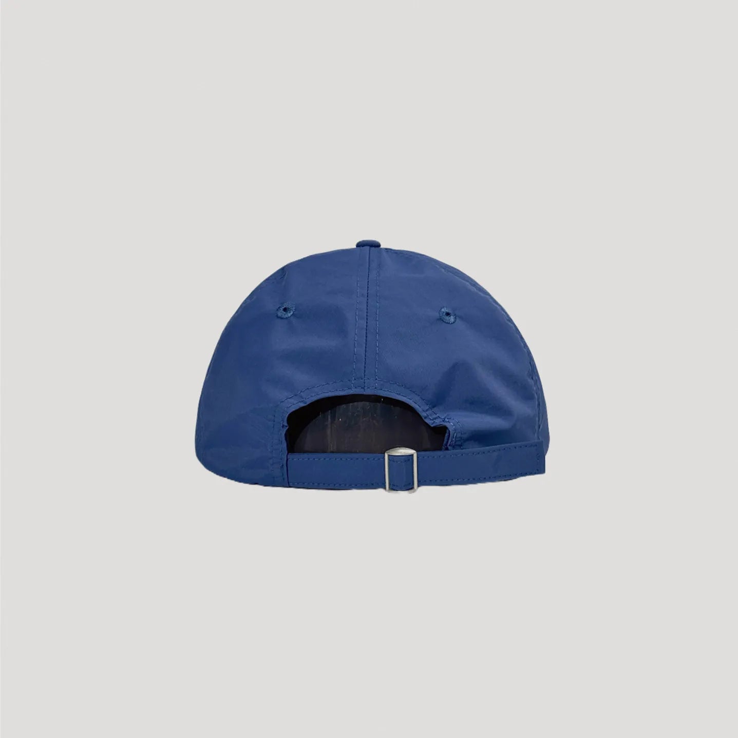 Navy lightweight nylon cap back view with adjustable metal buckle strap