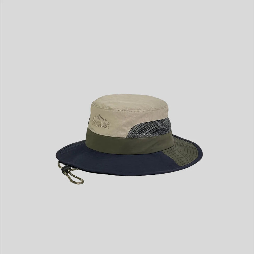 Nylon safari hat in left side profile, with grey mesh panels, a navy and olive brim and adjustable chin cord.