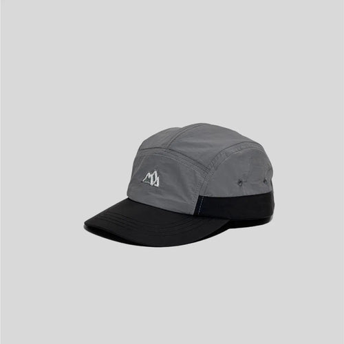 Nylon five panel cap in grey and black, angled view with curved brim, eyelets and mountain embroidery