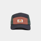 Nylon five panel cap in navy, burnt orange and forest green, front view with a woven logo patch and curved stitched peak