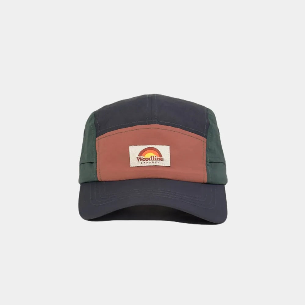 Nylon five panel cap in navy, burnt orange and forest green, front view with a woven logo patch and curved stitched peak