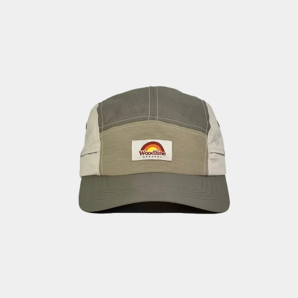 Nylon five panel cap in olive grey, khaki and cream, front view with a woven logo patch and curved stitched peak