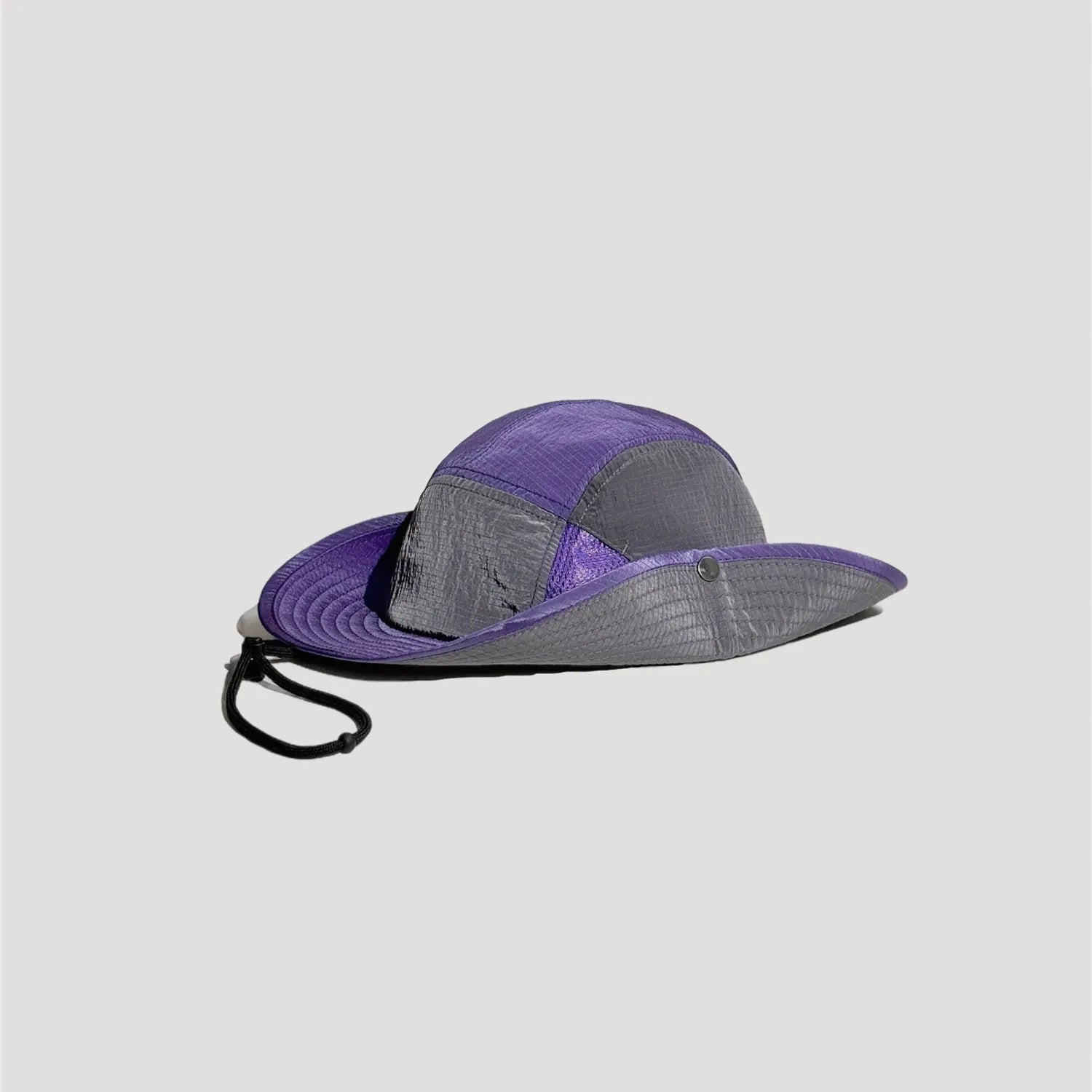 Nylon outdoor bucket hat side profile with wide brim and colour block panel design