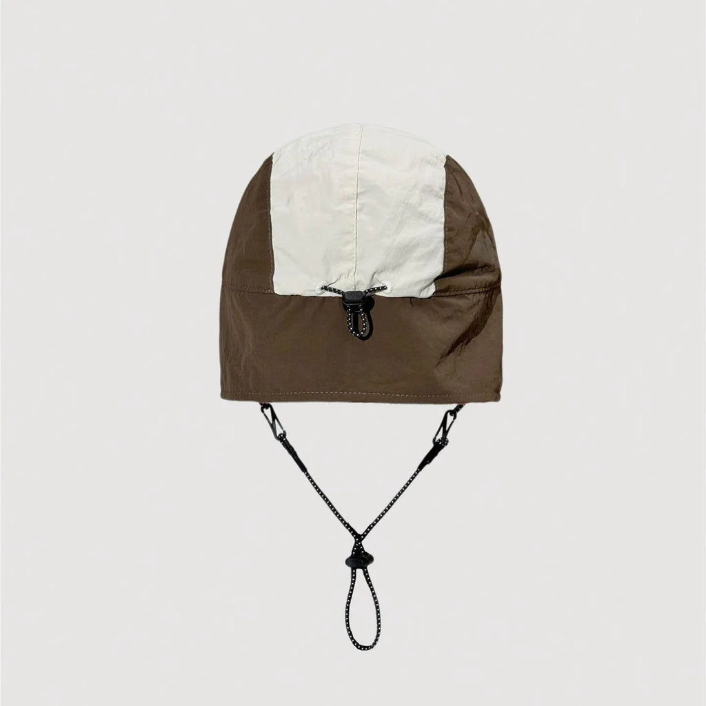 Adjustable nylon winter cap showing rear fastening system and stitched panel details