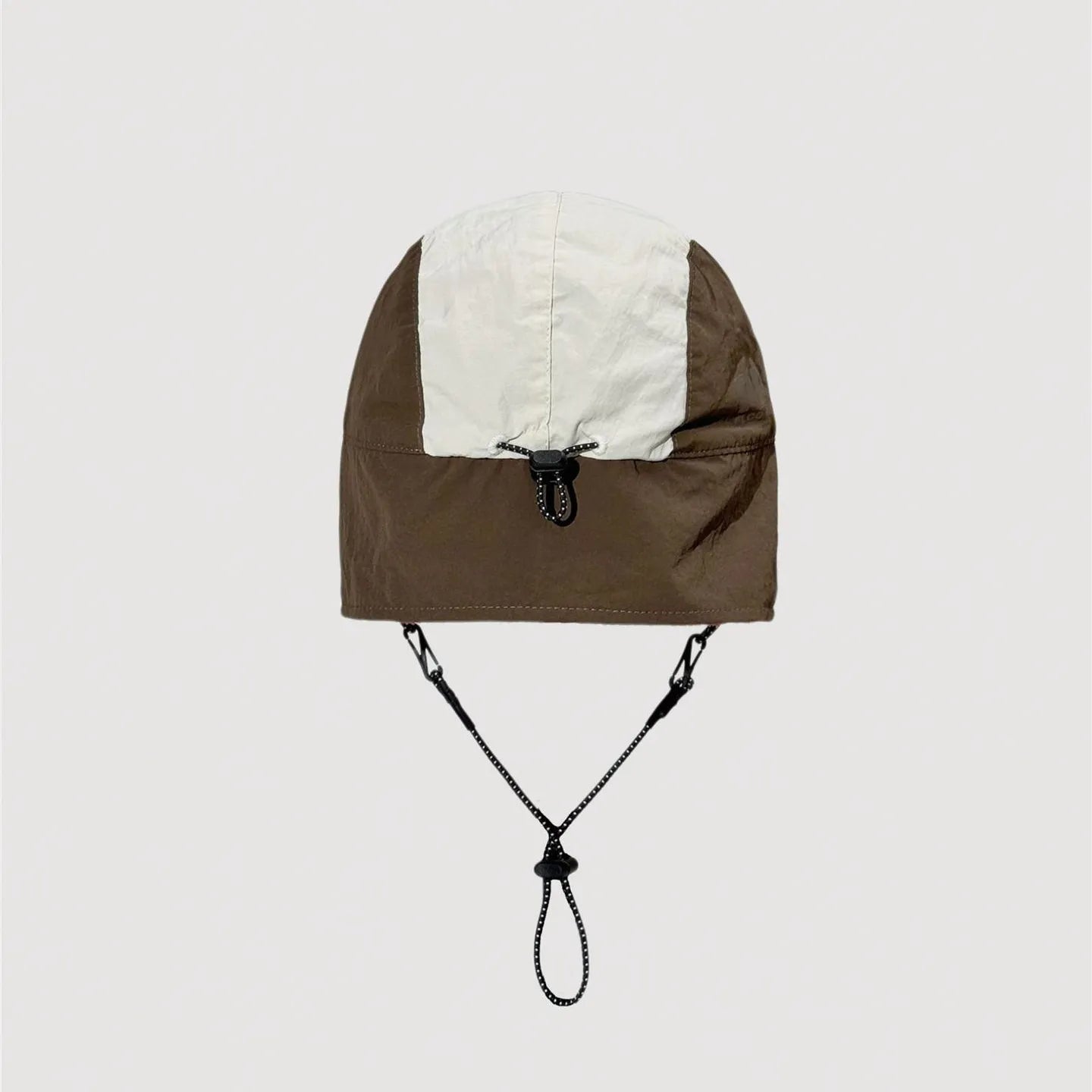 Adjustable nylon winter cap showing rear fastening system and stitched panel details