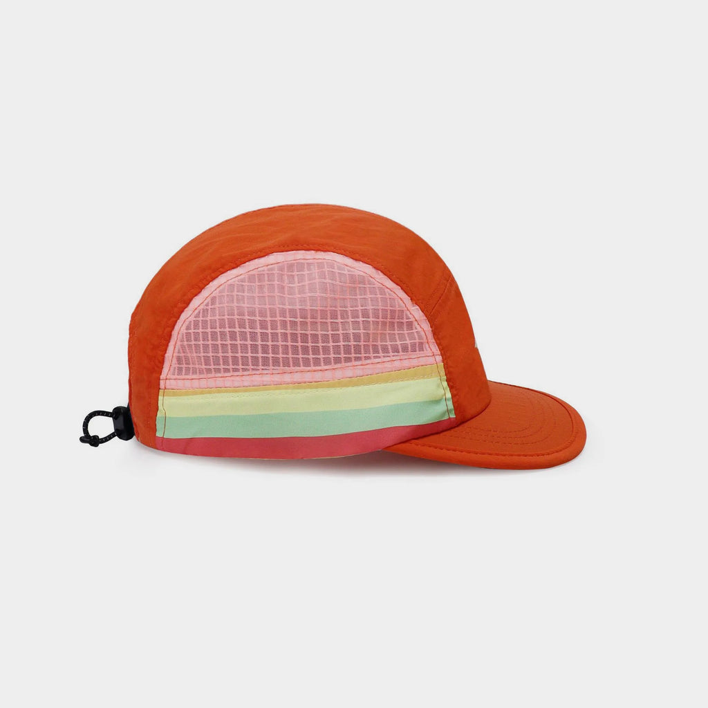 Orange lightweight nylon five-panel cap with a pink mesh side panel, multicolour stripes, short brim and rear drawcord.