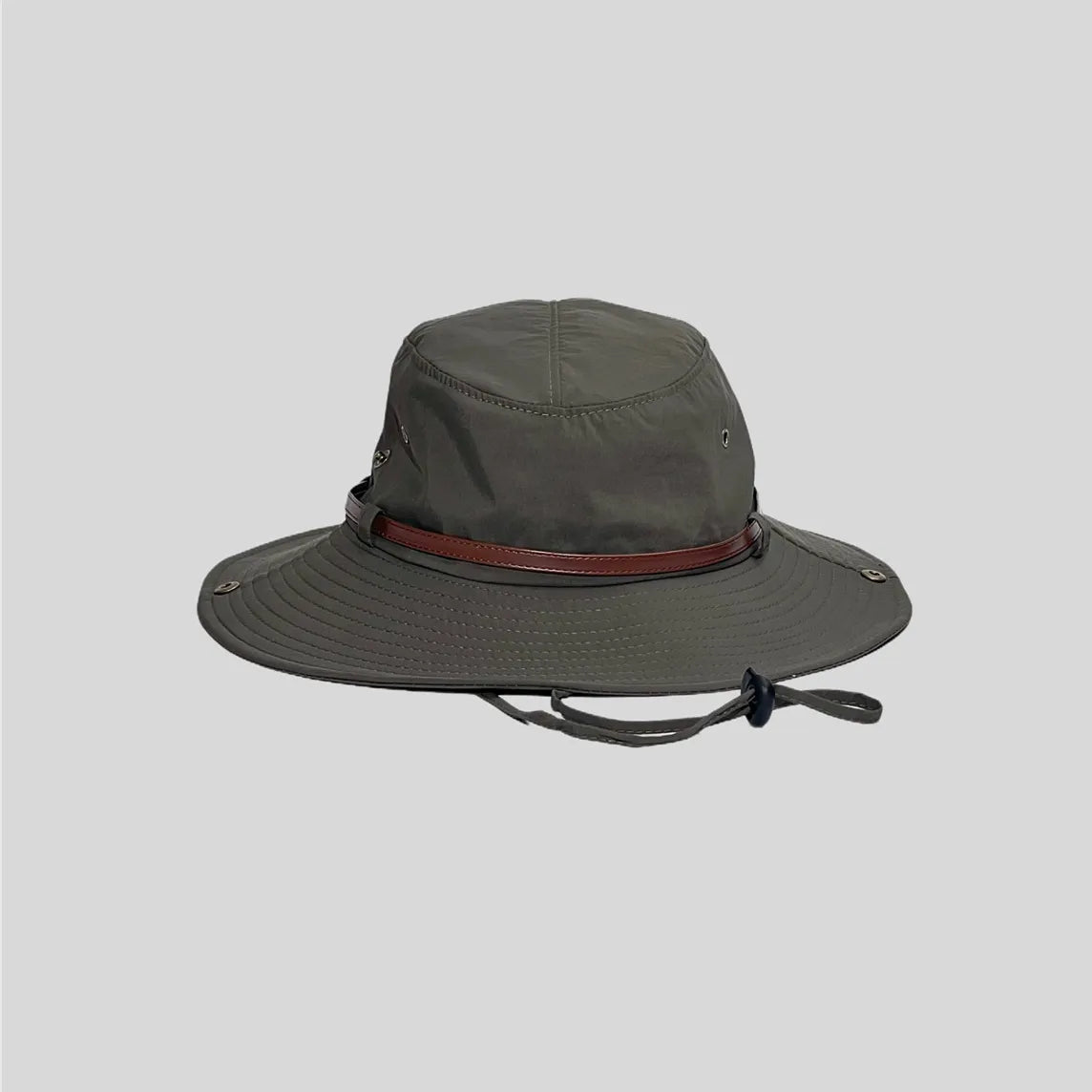 Outdoor bush hat in olive green, front view with a wide stitched brim, plain crown and brown trim band