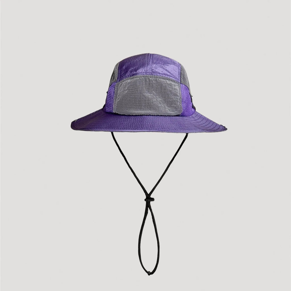 Purple nylon outdoor bucket hat with wide brim silhouette and technical design details