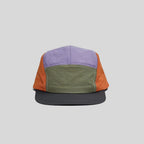 Quick-dry colour-block cap in lavender, olive and orange, front view showing the low crown and charcoal peak