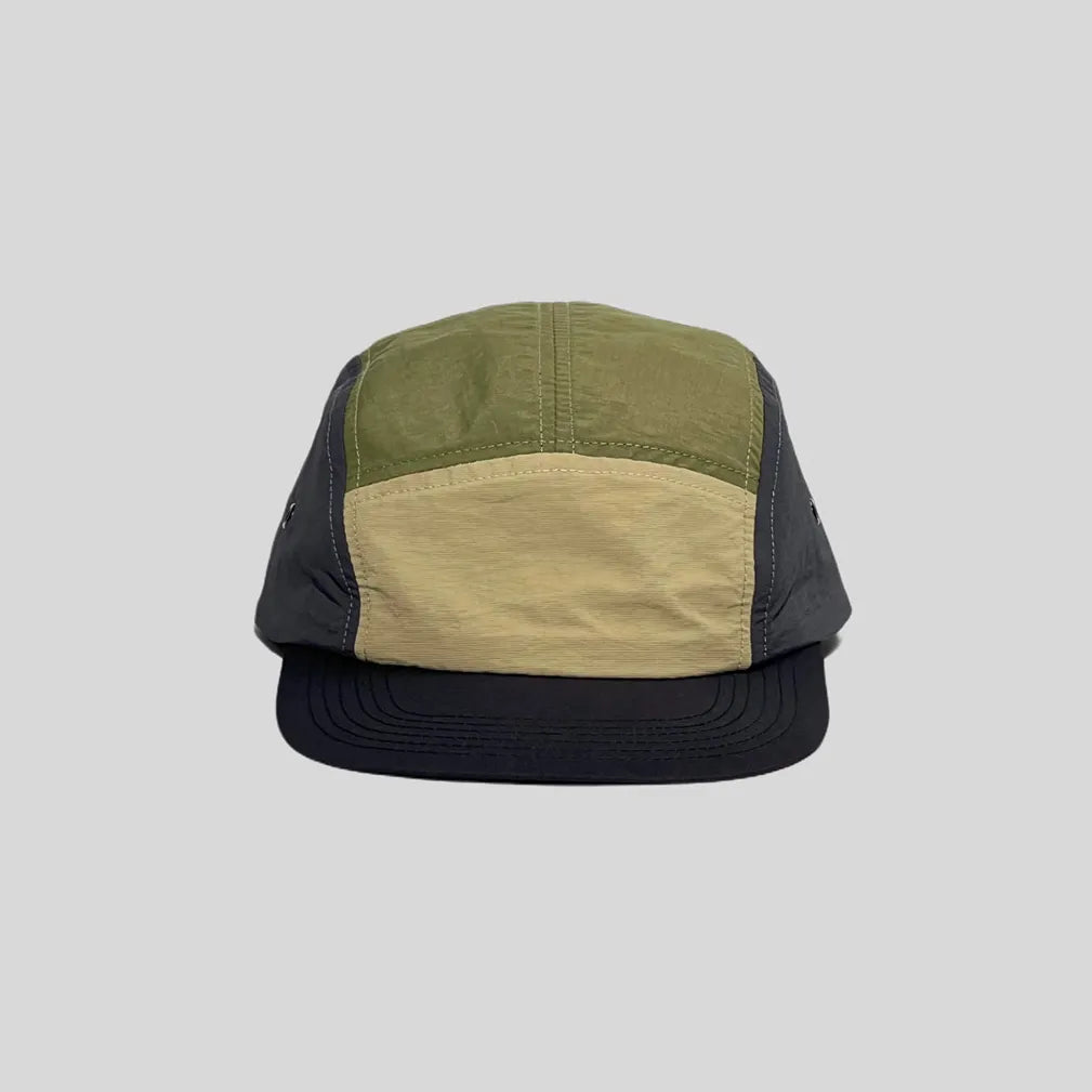 Quick-dry colour-block cap in olive, sand and charcoal, front view showing the low crown and black peak
