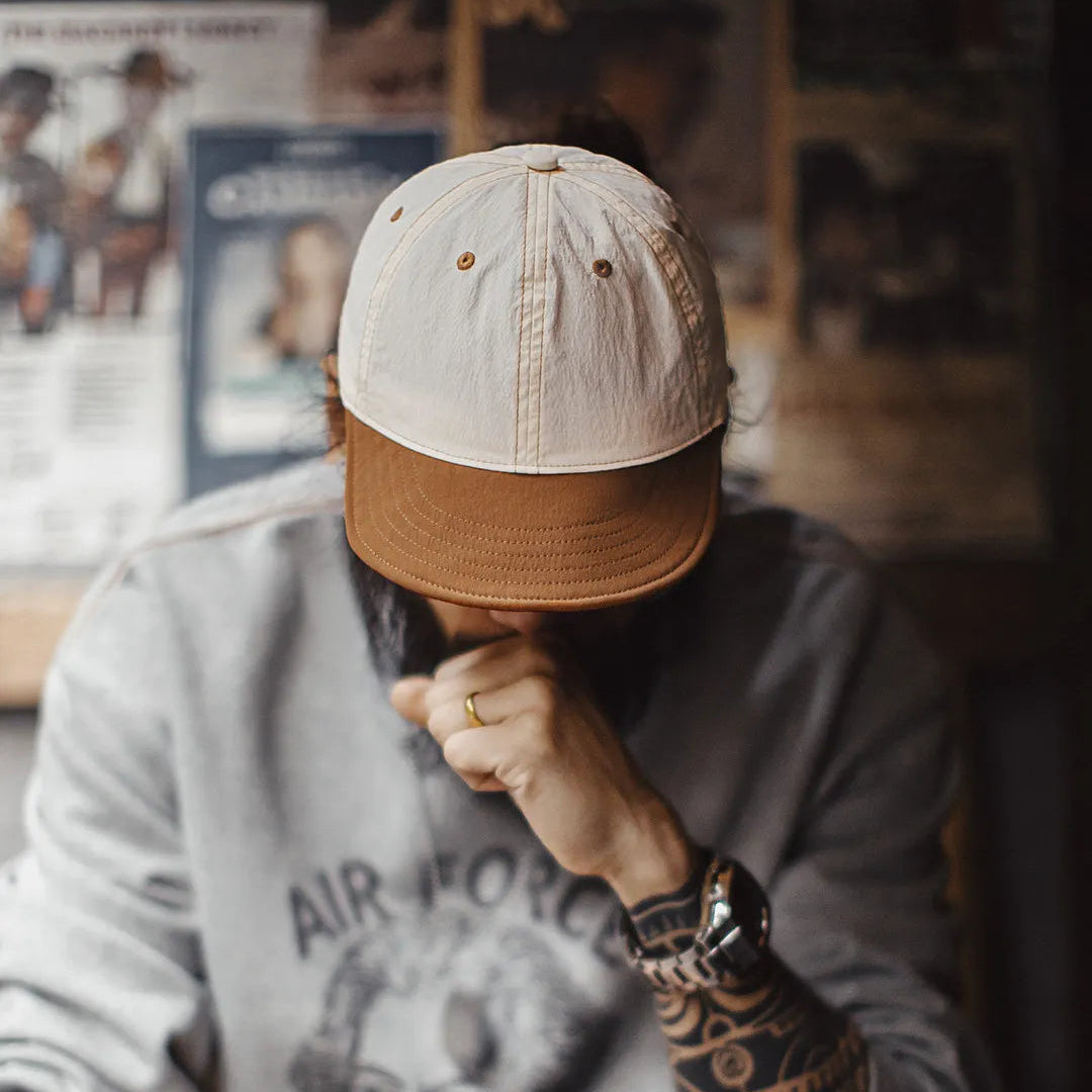 Retro dad cap worn with casual streetwear outfit featuring relaxed fit and curved brim
