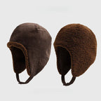 Dark brown reversible trapper hat shown with corduroy and teddy fleece sides, ear flaps and press-stud straps.